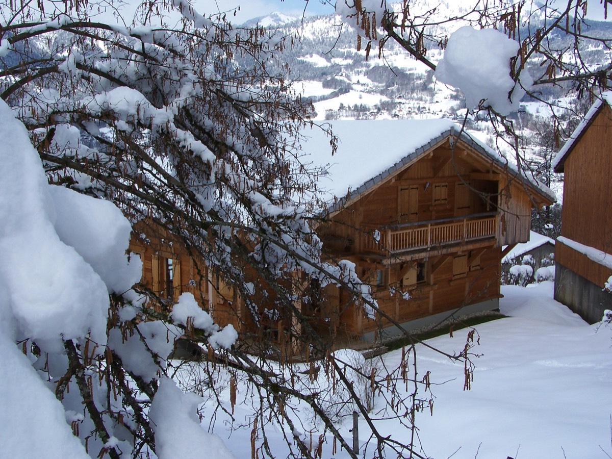 The chalet Perla de Na exterior view in winter 